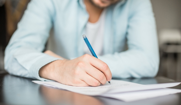 Man writing on the paper