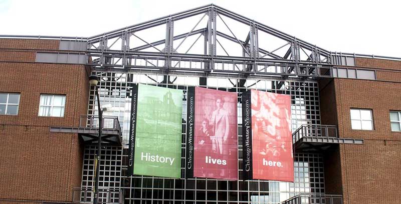 Green red and orange flags on the building